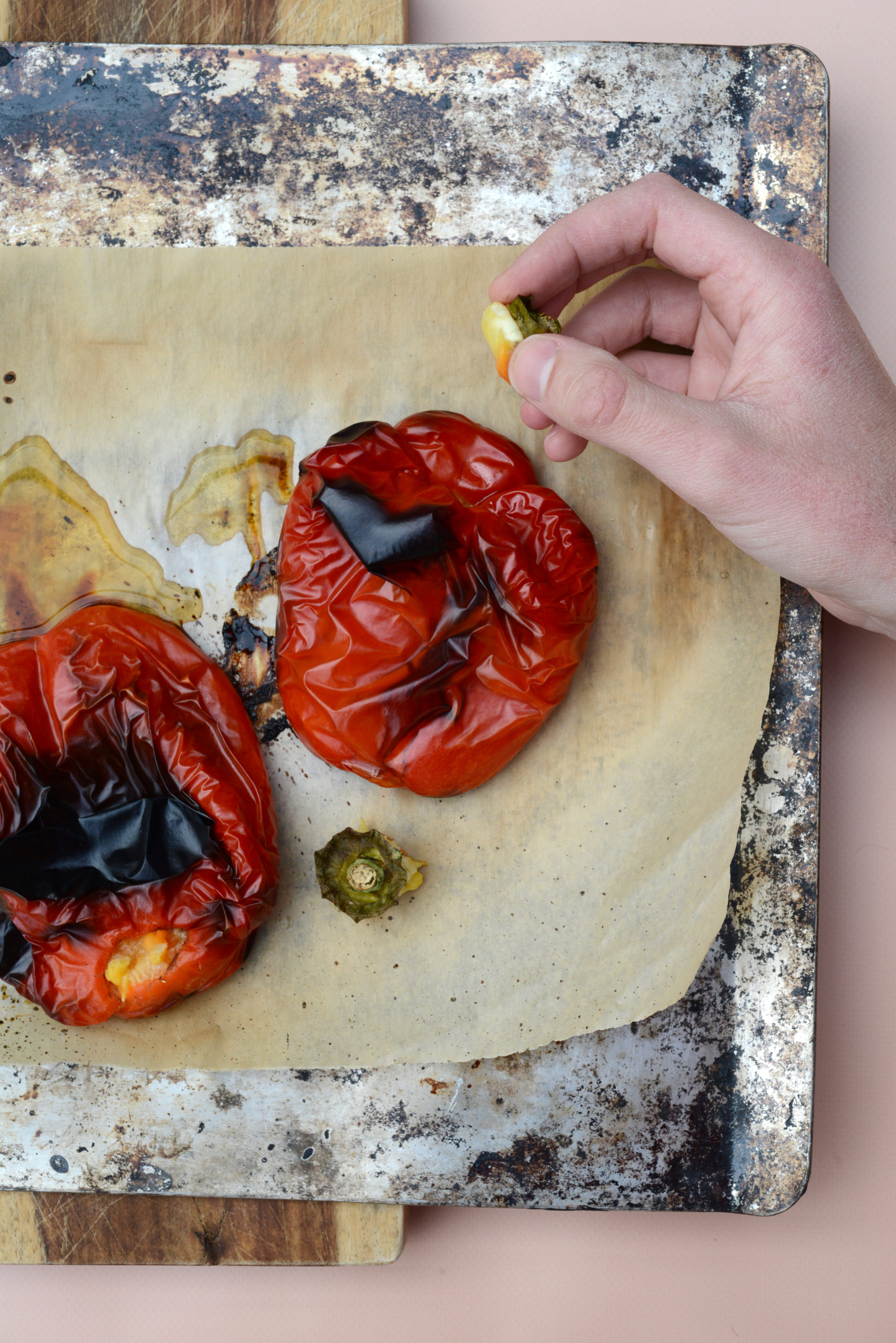 tangy roasted pepper dip [muhammara] red bell peppers after roasting removing stems
